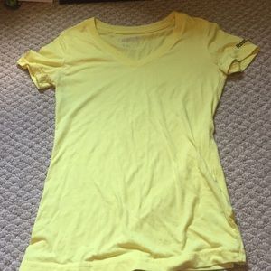 Small yellow Reebok T-shirt.